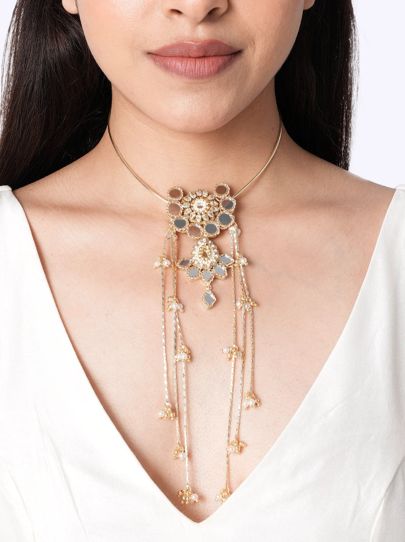 Aara Minimal Mirror Choker handcrafted with a floral mirror centerpiece, cascading chain tassels, faux pearls, glass bead detailing, brass metal, and a Gold Tone Finish, perfect for weddings, cocktail parties, festive occasions, receptions, mehendi, haldi, and contemporary ethnic styling.