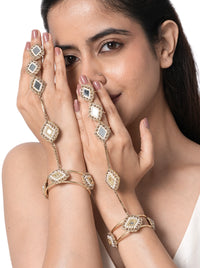 Aarini Mirror Bridal Haathphool handcrafted with geometric mirror motifs, faux pearls, glass bead detailing, and brass metal in a Gold Tone Finish, featuring adjustable finger rings and an open bangle, perfect for weddings, mehendi, haldi, receptions, festive occasions, and bridal styling.