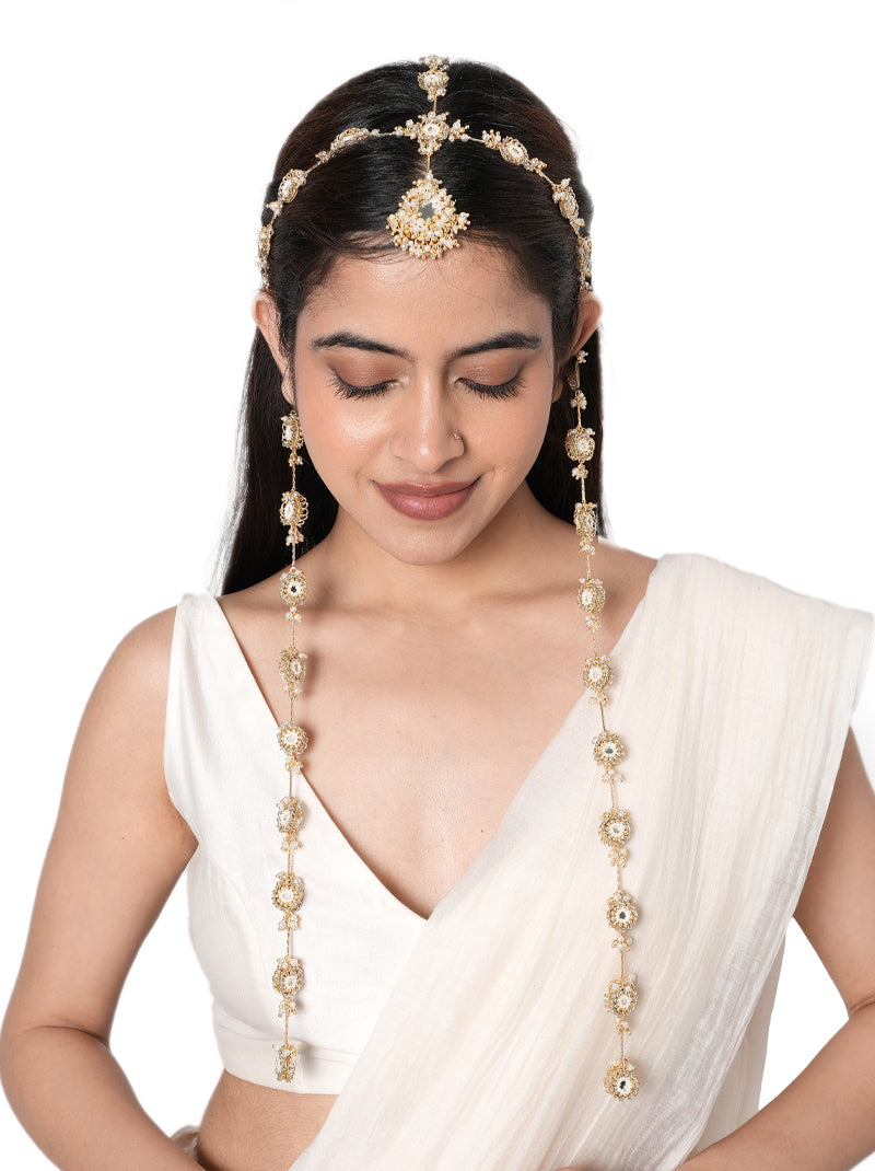 Aashi Mirror Designer Mathapatti handcrafted with intricate mirror motifs, faux pearls, glass bead detailing, and a Gold Tone Finish, featuring an elegant side chain design perfect for bridal entries, Haldi, Mehndi, Sangeet, weddings, receptions, and luxurious bridal hairstyles.