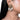 Aashvi Antique Bridal Earrings featuring intricate antique gold beadwork, pearl detailing and cascading white seashell danglers, styled on a woman.