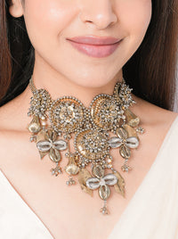 Handcrafted Aatvi Majestic Shell Choker featuring brass metal, shell motifs, pearl accents and intricate beadwork with an elegant Antique Finish.