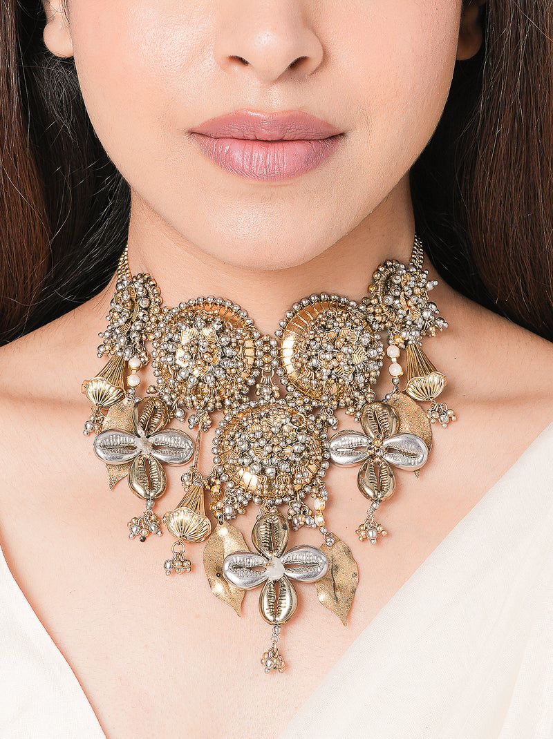 Handcrafted Aatvi Majestic Shell Choker featuring brass metal, shell motifs, pearl accents and intricate beadwork with an elegant Antique Finish.