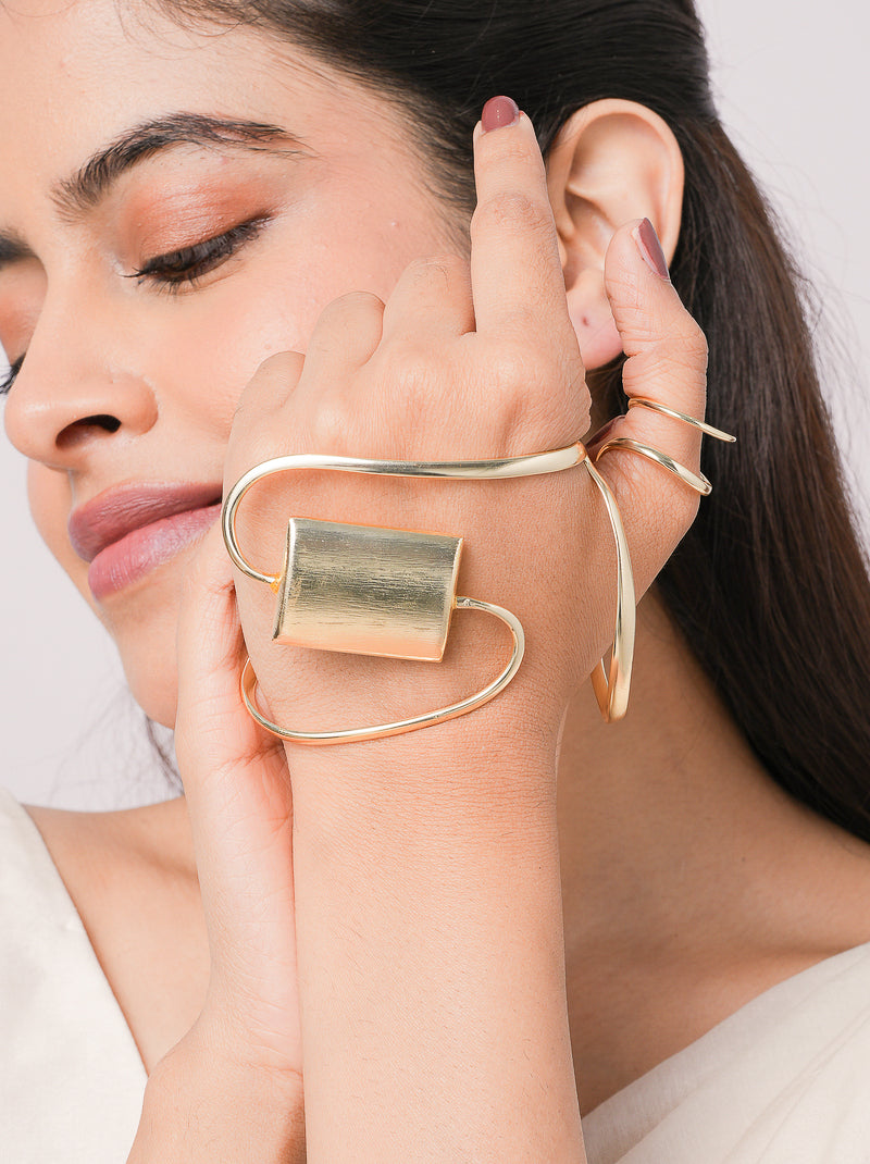 Ada Modern Statement Cuff handcrafted in premium brass featuring a sculptural open-wire design with a brushed geometric centerpiece and luxurious Gold Tone Finish for contemporary statement styling.