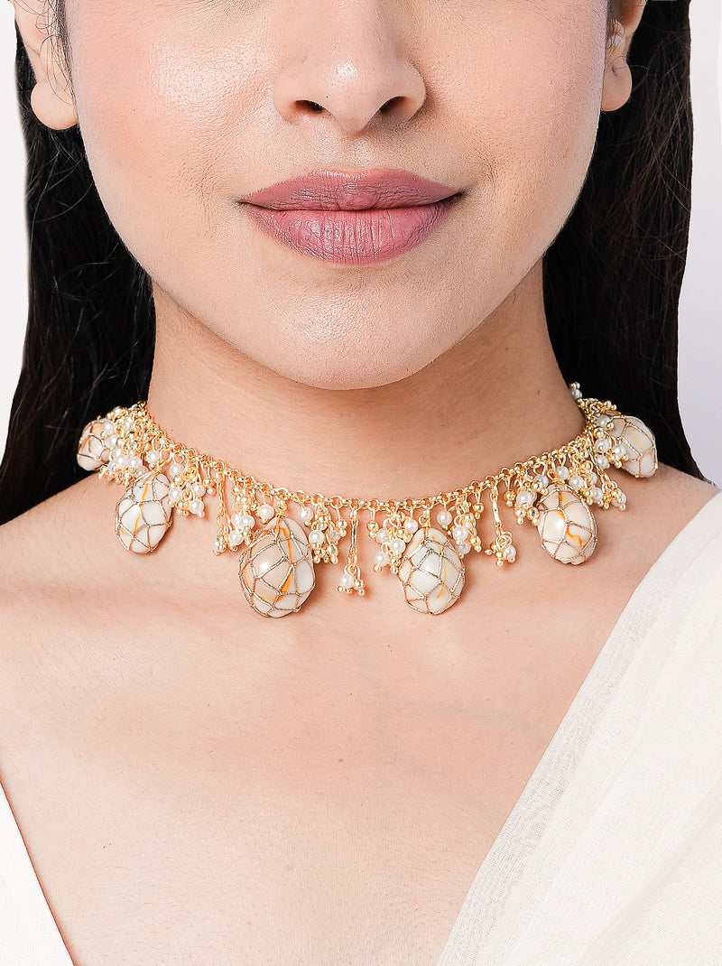 Handcrafted pearl beaded statement choker necklace with shell accents and gold detailing for bridal, festive and designer fashion styling.