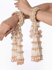 Anika Pearl Bridal Kaleera handcrafted with layered faux pearl tassels, floral accents, intricate glass bead embroidery, decorative bridal bangles, and a Gold Tone Finish, perfect for Haldi, Mehndi, bridal ceremonies, wedding rituals, bridal entry, receptions, and luxurious wedding styling.