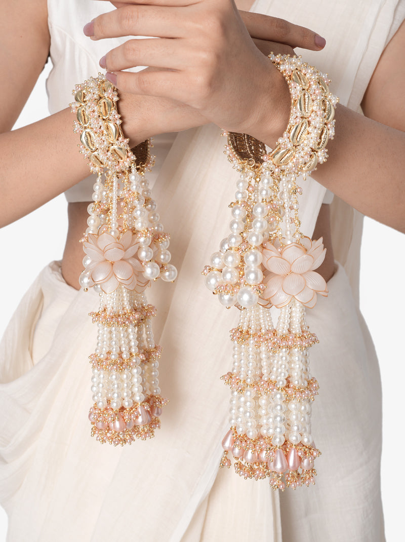 Anika Pearl Bridal Kaleera handcrafted with layered faux pearl tassels, floral accents, intricate glass bead embroidery, decorative bridal bangles, and a Gold Tone Finish, perfect for Haldi, Mehndi, bridal ceremonies, wedding rituals, bridal entry, receptions, and luxurious wedding styling.