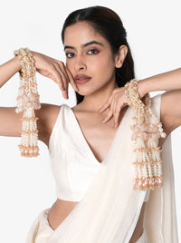 Anika Pearl Bridal Kaleera handcrafted with layered faux pearl tassels, floral accents, intricate glass bead embroidery, decorative bridal bangles, and a Gold Tone Finish, perfect for Haldi, Mehndi, bridal ceremonies, wedding rituals, bridal entry, receptions, and luxurious wedding styling.