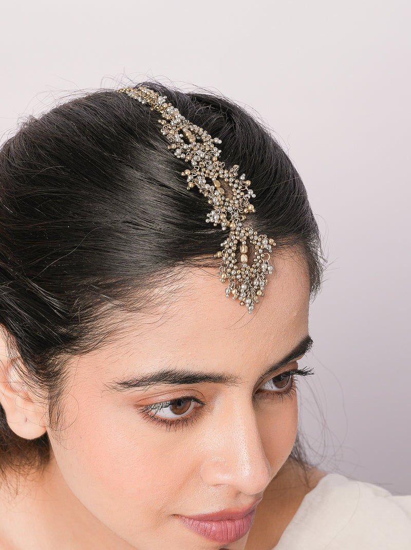 Handcrafted Anokhi Artisan Maangtika Jewel featuring brass metal, intricate beadwork and pearl accents with an elegant Antique Finish for bridal and festive wear.