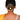 Model wearing Anuradha Metallic Bun Accessory featuring layered concentric brass circles with a floral centrepiece in a contemporary gold tone hair bun design.