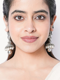 Ashi handcrafted statement earrings featuring intricate beaded detailing with a silver tone finish, ideal for weddings, festive celebrations, and contemporary ethnic styling.