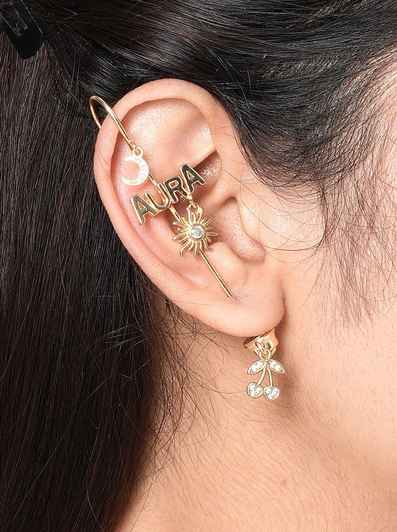 Aura Moodcuff pair handcrafted in brass metal with AURA lettering, crescent moon charm, sun motif with glass stone detailing, and a Gold Tone Finish, perfect for parties, festive occasions, vacations, concerts, and contemporary statement styling.