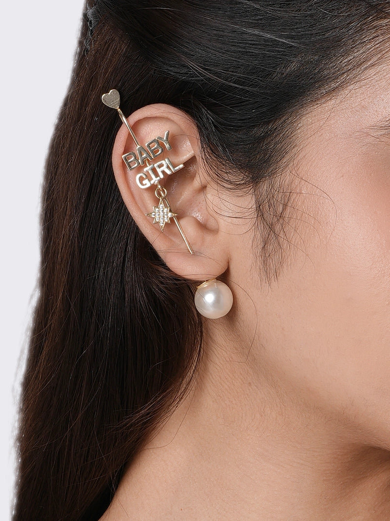 Baby Girl Moodcuff handcrafted in brass metal with white enamel BABY GIRL lettering, a sparkling star charm and a Gold Tone Finish, perfect for birthdays, parties, vacations, festive occasions and contemporary statement styling.
