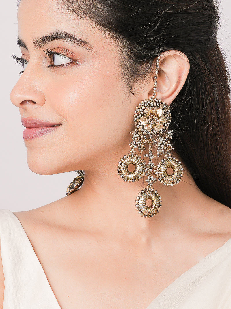 Bhagya Antique Chand Earrings featuring handcrafted floral detailing, cascading circular charms and antique gold finish for bridal, festive and traditional wear.