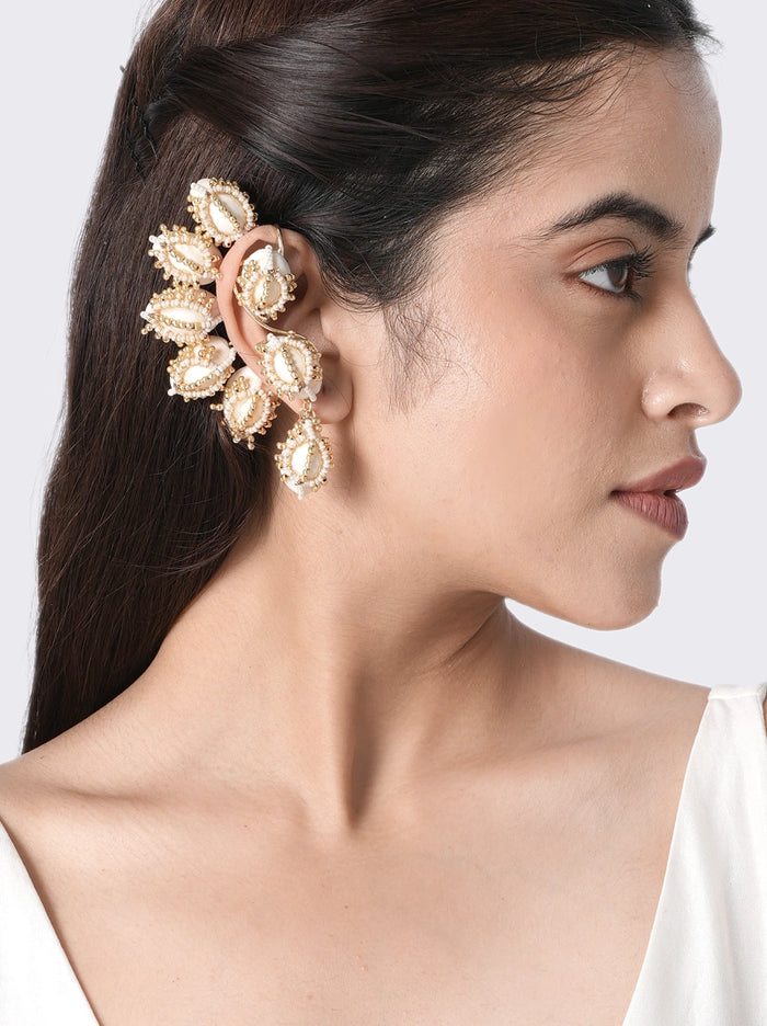 Celeste Shell Statement Earring handcrafted with natural shell motifs, faux pearls, glass beads, and brass metal in a Gold Tone Finish, featuring an elegant ear cuff design perfect for beach weddings, festive occasions, destination weddings, and contemporary styling.