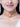 Chitra Floral Pearl Choker handcrafted with floral motifs, pearl embellishments, peach bead detailing, and an elegant gold tone finish for festive and wedding styling.