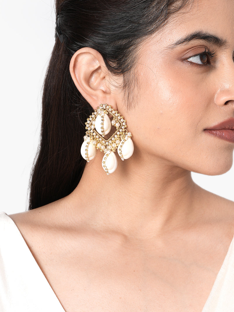  Darika  Handmade Cowrie Earrings handcrafted with natural cowrie shells, faux pearls, intricate glass bead embroidery, and a Gold Tone Finish, creating elegant statement earrings perfect for Haldi, Mehndi, weddings, receptions, destination weddings, festive celebrations, and ethnic styling.