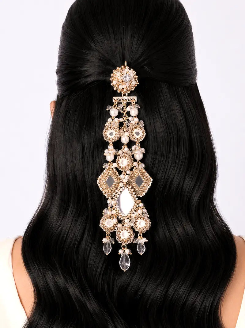 Darshini Mirror Hair Accessory handcrafted with floral mirror motifs, crystal embellishments, faux pearls, geometric mirror accents and antique gold finish, designed for bridal hairstyles, weddings and festive occasions.
