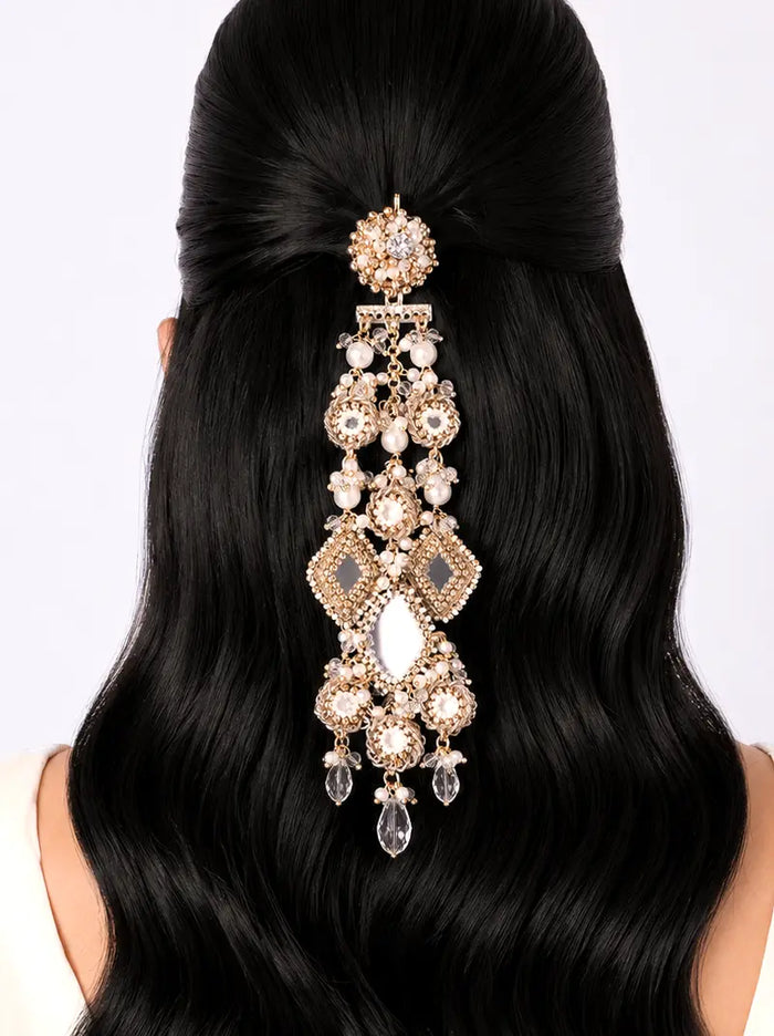 Darshini Mirror Hair Accessory handcrafted with floral mirror motifs, crystal embellishments, faux pearls, geometric mirror accents and antique gold finish, designed for bridal hairstyles, weddings and festive occasions.