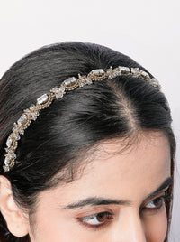 Handcrafted Dharmi Crystal Designer Hairband featuring baguette-cut crystals, intricate beadwork, and an antique gold finish for bridal, festive, and wedding hairstyles.
