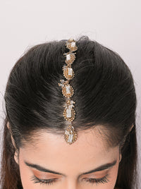 Handcrafted Dharmi Crystal Heritage Maangtika featuring baguette-cut glass crystals, intricate brass beadwork and an elegant Antique Finish for bridal and festive wear.