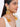 Diya Shell Statement Earrings with natural shells, faux pearls and gold-tone detailing Handcrafted shell and pearl statement earrings for Indian festive and wedding wear.