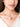 Drip Choker featuring pearl accents on a sculptural gold-tone collar necklace, contemporary statement jewelry for weddings, festive wear, and modern fashion styling.