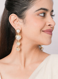 Drip Earrings featuring cascading pearl drops with sculptural gold-tone detailing, statement designer earrings for weddings, festive occasions, and contemporary styling.