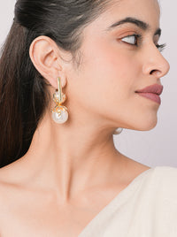 Drip Hoops featuring pearl drop accents with sculptural gold-tone detailing, designer hoop earrings for weddings, festive occasions, and contemporary fashion styling.