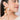 Drip Hula Hoops featuring oversized gold-tone hoops adorned with pearl accents, statement designer earrings for weddings, festive occasions, and contemporary fashion styling.