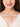 Drip Necklace featuring cascading pearl accents suspended from a gold-tone chain, contemporary statement jewelry for festive wear, wedding styling, and modern fashion.