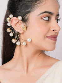 Drip Rays Earcuff featuring cascading gold-tone rays and pearl accents, statement ear jewelry for contemporary fashion, festive styling, and elevated occasion wear.