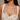Drip Strands statement necklace featuring cascading pearl accents suspended from gold-tone chains, designer jewelry for weddings, festive occasions, and contemporary fashion styling.