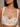 Drip Strands statement necklace featuring cascading pearl accents suspended from gold-tone chains, designer jewelry for weddings, festive occasions, and contemporary fashion styling.