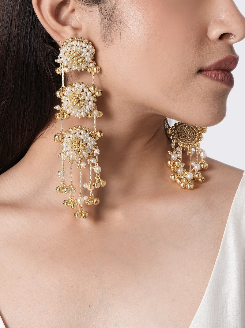 Elina Pearl Festive Earrings handcrafted with layered floral faux pearls, glass bead detailing, ghungroo-inspired accents, and brass metal in a Gold Tone Finish, designed for weddings, mehendi, sangeet, festive celebrations, receptions, and elegant ethnic styling.