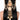 Gayatri Statement Hair Accessory featuring peach floral motifs, faux pearls, gold-tone beads and cascading embellishments styled on long hair.