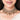 Handcrafted Inaara Antique Layered Choker in antique gold and silver finish featuring layered crystal detailing, floral motifs, intricate beadwork, and cascading bell charms for bridal, wedding, and festive ethnic wear.