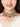 Handcrafted Inaara Antique Layered Choker in antique gold and silver finish featuring layered crystal detailing, floral motifs, intricate beadwork, and cascading bell charms for bridal, wedding, and festive ethnic wear.