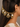 Jivika Regal Antique Earchain handcrafted with brass metal, oval glass stone motifs, delicate glass bead tassels, and an Antique Tone Finish, perfect for bridal wear, weddings, festive occasions, and traditional Indian styling.