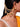 Jyoti Pearl Designer Earchain handcrafted with layered pearl chains, colourful bead accents, and a gold tone finish for bridal wear.