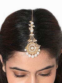 Kanishka Pearl Festive Maangtika handcrafted with a mirror centerpiece, faux pearl drops, intricate glass bead detailing, and a Gold Tone Finish, perfect for Haldi, Mehndi, weddings, receptions, festive celebrations, poojas, and elegant bridal styling.