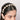 Kasturi Cowrie Shell Hairband featuring handcrafted cowrie shell tassels, pearl embellishments, and gold tone detailing, designed for bridal hairstyles, haldi celebrations, mehendi functions, destination weddings, festive occasions, and boho ethnic fashion styling.
