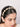 Kasturi Cowrie Shell Hairband featuring handcrafted cowrie shell tassels, pearl embellishments, and gold tone detailing, designed for bridal hairstyles, haldi celebrations, mehendi functions, destination weddings, festive occasions, and boho ethnic fashion styling.