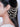 Mahnoor Pearl Crystal Earchain featuring layered faux pearl chains, faceted glass crystal drops, handcrafted bead detailing, and antique gold finish designer bridal hair jewelry.