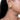 Manyata Pearl Stud Earrings featuring intricate gold-tone beadwork and white faux pearl detailing, styled on a woman.