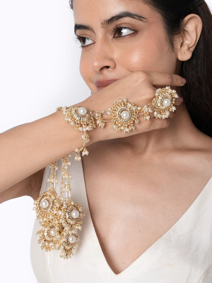 modern statement haathphool, bridal haathphool, pearl haathphool, handcrafted jewelry, faux pearl jewelry, glass stone jewelry, brass jewelry, wedding jewelry, festive jewelry, mehendi jewelry, haldi jewelry, bridal accessories, vaidaan