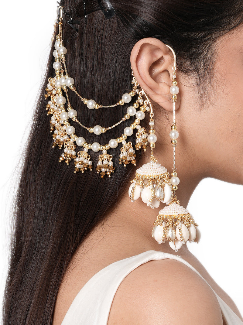 Miska Handmade Shell Earrings handcrafted with shell jhumkas, layered pearl earchain, faux pearls, glass beads, and a Gold Tone Finish, perfect for Haldi, Mehndi, weddings, receptions, destination weddings, and luxury bridal styling.