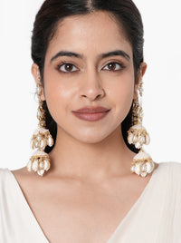 Miska Handmade Shell Earrings handcrafted with shell jhumkas, layered pearl earchain, faux pearls, glass beads, and a Gold Tone Finish, perfect for Haldi, Mehndi, weddings, receptions, destination weddings, and luxury bridal styling.