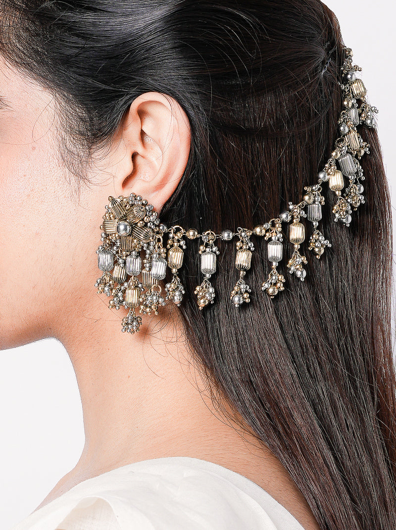 Handcrafted Shivani heritage dangler earrings crafted in brass with beadwork and faux pearl accents in an elegant antique finish.