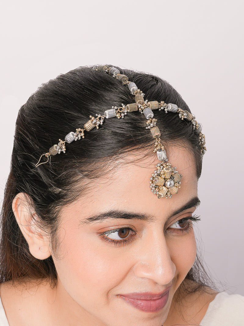 Handcrafted Mohita Regal Mathapatti Headpiece featuring a floral brass design in antique gold and silver tones with an elegant Antique Finish for bridal and festive wear.