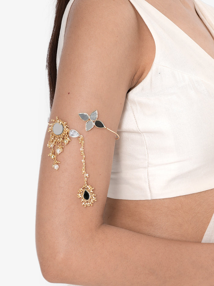 Mokshika Mirror Ethnic Bajuband handcrafted with floral mirror motifs, faux pearls, cascading chain details, intricate glass bead embroidery, and a Gold Tone Finish, perfect for Haldi, Mehndi, weddings, receptions, festive celebrations, and elegant bridal styling.
